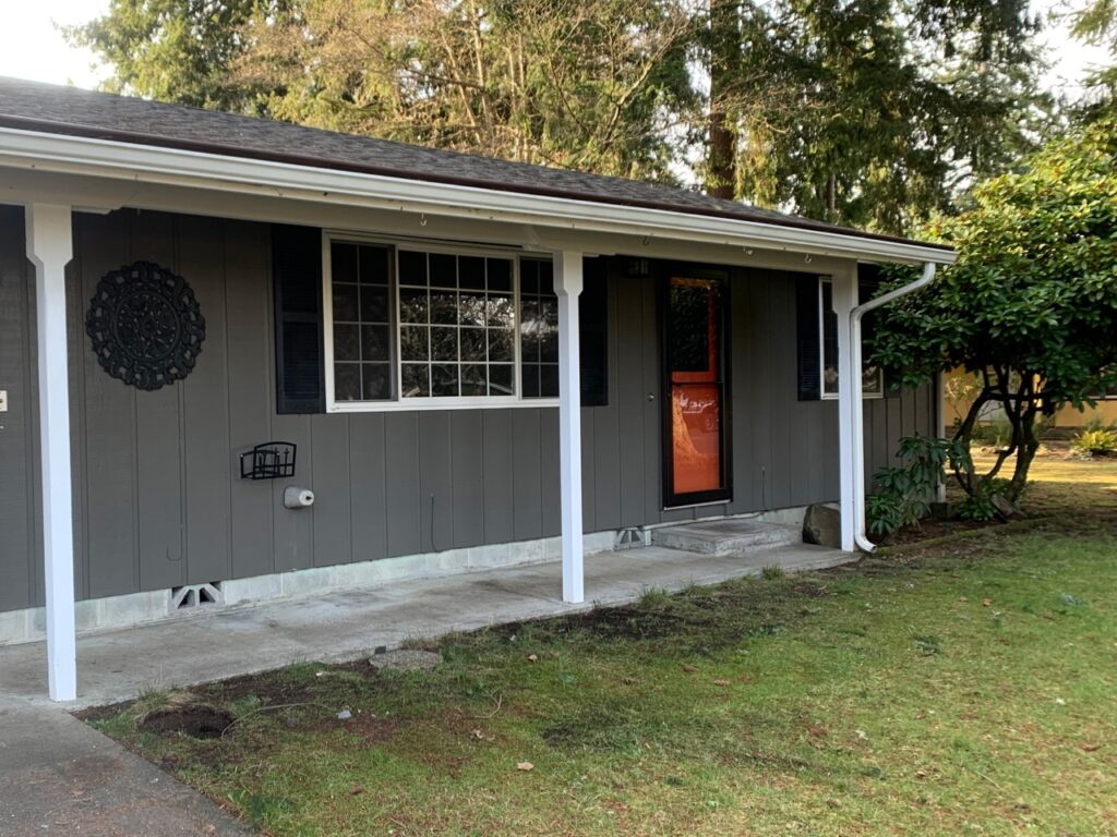 before exterior painting dark grey and orange door