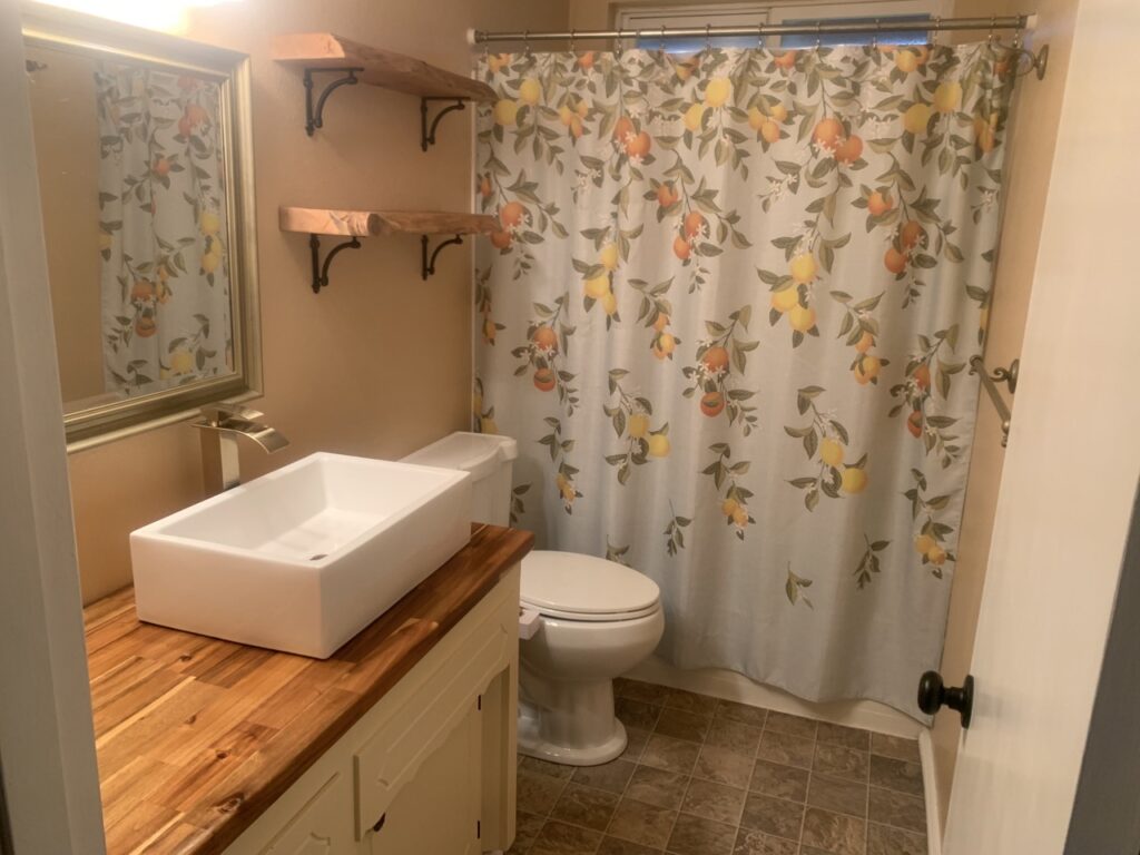 After image of bathroom renovation. Countertop installation and interior painting by Woodgrain Construction