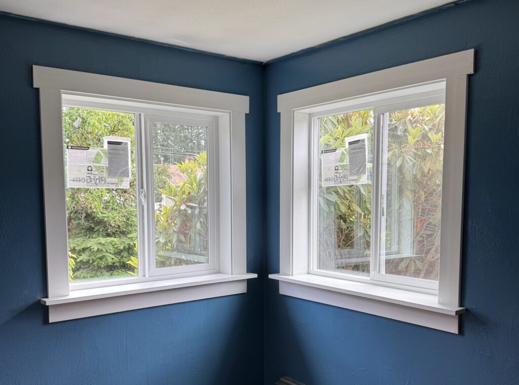 New window install in Olympia WA. White trim and blue walls.